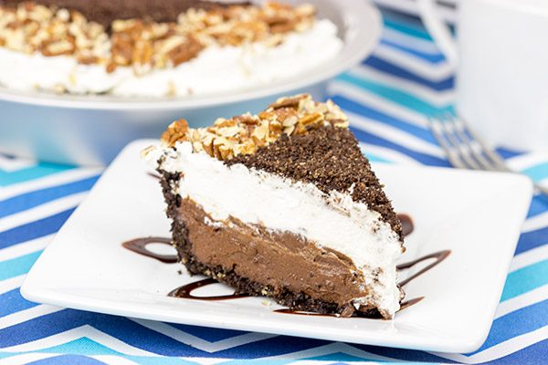 This Mocha Mississippi Mud Pie features a chocolate-pecan crust filled with a decadent mocha chocolate pudding. Add some whipped cream, and you've got the perfect summer dessert!