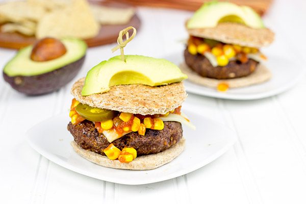 Loaded with southwestern seasonings and topped with corn salsa, this Southwestern Taco Burger is a fun way to mix up burger night!