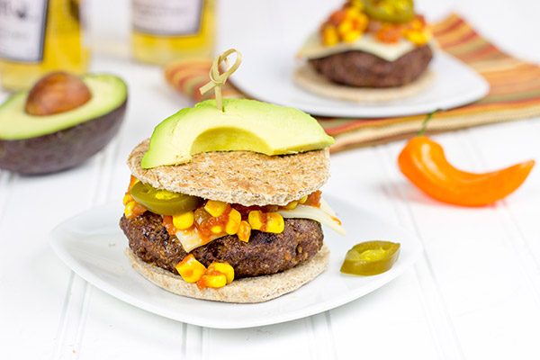 Loaded with southwestern seasonings and topped with corn salsa, this Southwestern Taco Burger is a fun way to mix up burger night!