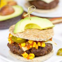 Loaded with southwestern seasonings and topped with corn salsa, this Southwestern Taco Burger is a fun way to mix up burger night!