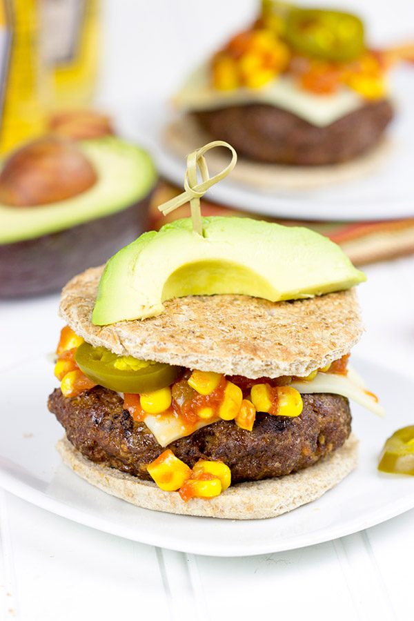Loaded with southwestern seasonings and topped with corn salsa, this Southwestern Taco Burger is a fun way to mix up burger night!