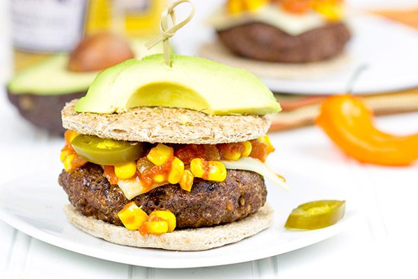 Loaded with southwestern seasonings and topped with corn salsa, this Southwestern Taco Burger is a fun way to mix up burger night!