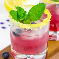 Garnished with lemon sugar, this Blueberry Bourbon Smash makes for one heck of an awesome summer cocktail!