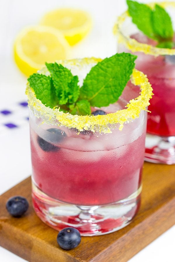 Garnished with lemon sugar, this Blueberry Bourbon Smash makes for one heck of an awesome summer cocktail!