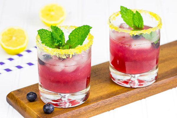 Garnished with lemon sugar, this Blueberry Bourbon Smash makes for one heck of an awesome summer cocktail!
