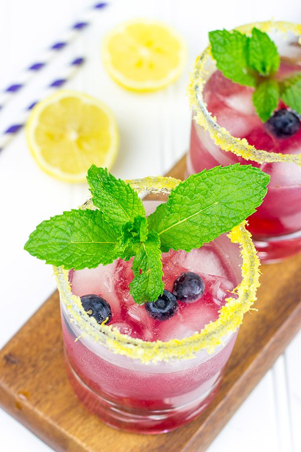 Garnished with lemon sugar, this Blueberry Bourbon Smash makes for one heck of an awesome summer cocktail!