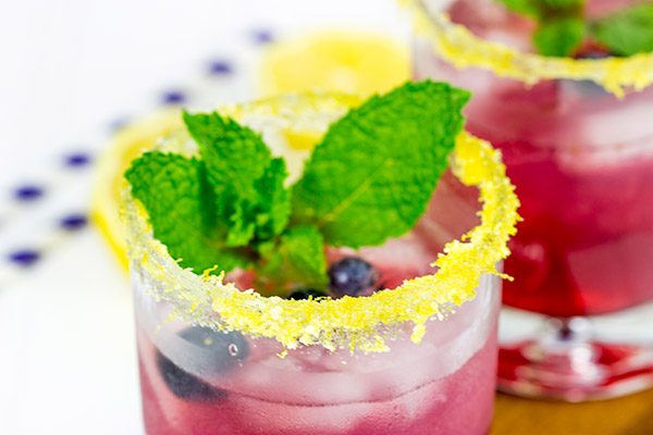 Garnished with lemon sugar, this Blueberry Bourbon Smash makes for one heck of an awesome summer cocktail!