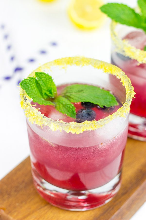 Garnished with lemon sugar, this Blueberry Bourbon Smash makes for one heck of an awesome summer cocktail!