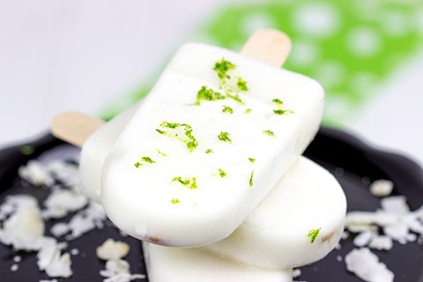 These tropical Coconut Lime Popsicles are a fun and refreshing snack on a hot summer afternoon!