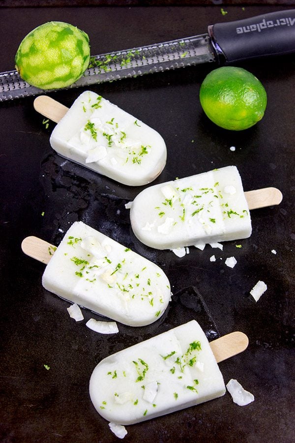 These tropical Coconut Lime Popsicles are a fun and refreshing snack on a hot summer afternoon!