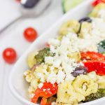 This Greek Tortellini Pasta Salad is loaded with all of your favorite Greek salad toppings...and it's perfect for summer picnics!
