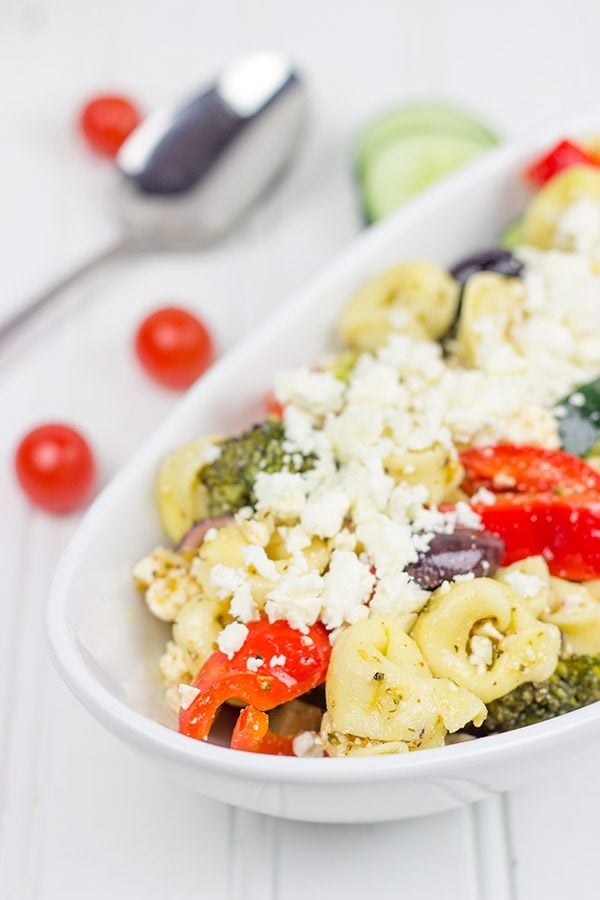 This Greek Tortellini Pasta Salad is loaded with all of your favorite Greek salad toppings...and it's perfect for summer picnics!