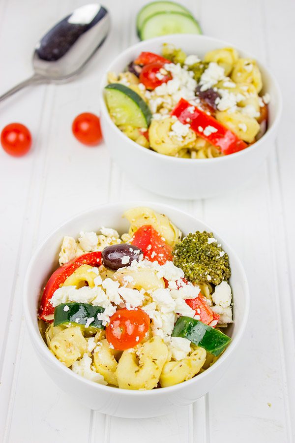 This Greek Tortellini Pasta Salad is loaded with all of your favorite Greek salad toppings...and it's perfect for summer picnics!