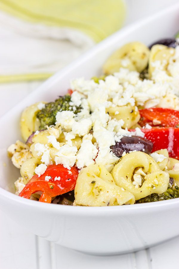 This Greek Tortellini Pasta Salad is loaded with all of your favorite Greek salad toppings...and it's perfect for summer picnics!