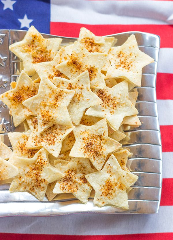 Serve these star-shaped Seasoned Tortilla Chips with homemade salsa for a delicious 4th of July snack!
