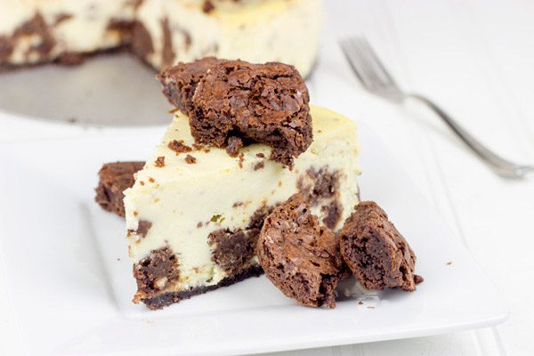 Complete with brownie bites baked into this cheesecake and piled high on top, this Brownie Bite Cheesecake is an impressive dessert to serve to company!