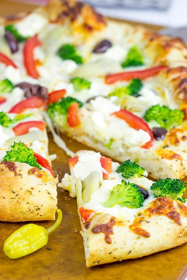 Topped with artichokes, olives and feta, this Greek Pizza is perfect for weekend pizza night!