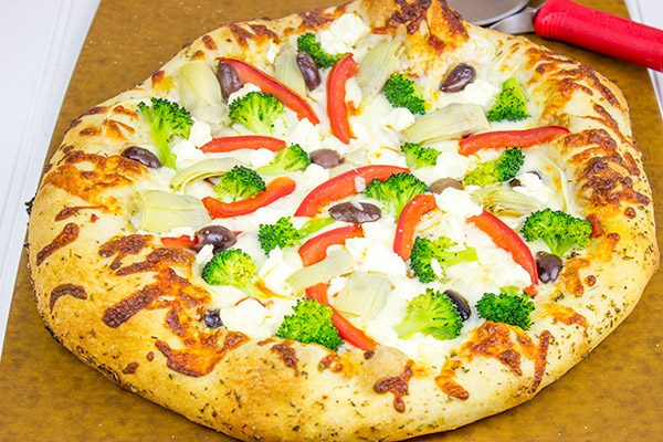 Topped with artichokes, olives and feta, this Greek Pizza is perfect for weekend pizza night!