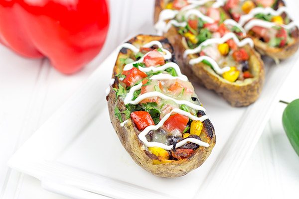 Loaded with layers of flavor, these Grilled Southwestern Potato Skins are one heck of a delicious summer appetizer!