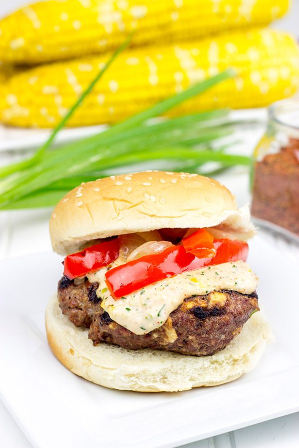 Loaded with Cajun flavor and topped with a remoulade sauce, these Spicy Cajun Burgers are sure to be a hit at your next backyard picnic!