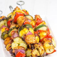 Brushed with a quick and easy glaze, these Spicy Honey BBQ Chicken Skewers make for one heck of a tasty dinner on the grill!