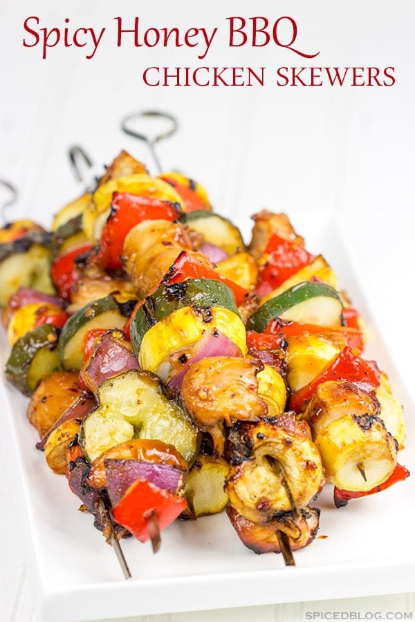 Brushed with a quick and easy glaze, these Spicy Honey BBQ Chicken Skewers make for one heck of a tasty dinner on the grill!