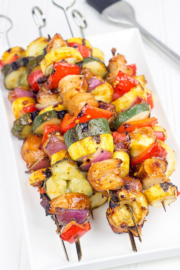 Brushed with a quick and easy glaze, these Spicy Honey BBQ Chicken Skewers make for one heck of a tasty dinner on the grill!