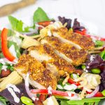 Topped with sriracha almond-encrusted chicken and a sriracha ranch dressing, this Sriracha Almond Chicken Salad makes for a tasty summer lunch!