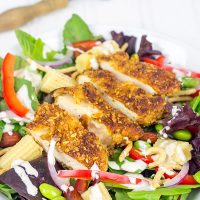 Topped with sriracha almond-encrusted chicken and a sriracha ranch dressing, this Sriracha Almond Chicken Salad makes for a tasty summer lunch!