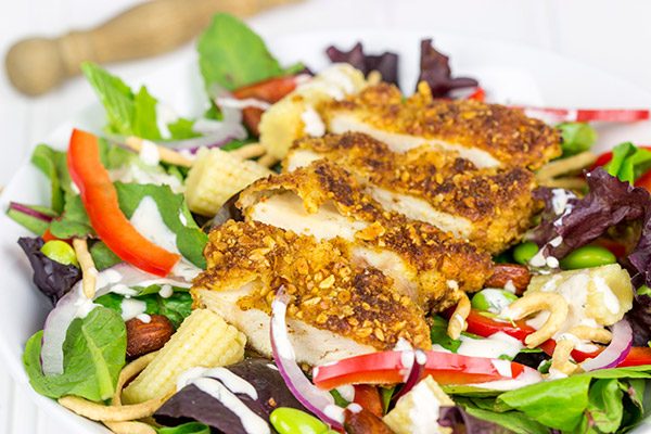 Topped with sriracha almond-encrusted chicken and a sriracha ranch dressing, this Sriracha Almond Chicken Salad makes for a tasty summer lunch!