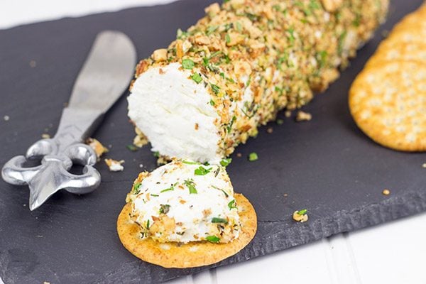 Rolled in chopped almonds and fresh herbs, this Almond Herb Goat Cheese makes for a quick and tasty summer snack!