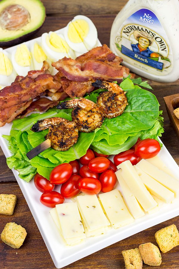 Topped with grilled Cajun shrimp, this Cajun Shrimp Chef Salad makes for one heck of a delicious summer meal!