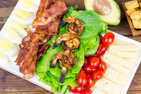 Topped with grilled Cajun shrimp, this Cajun Shrimp Chef Salad makes for one heck of a delicious summer meal!