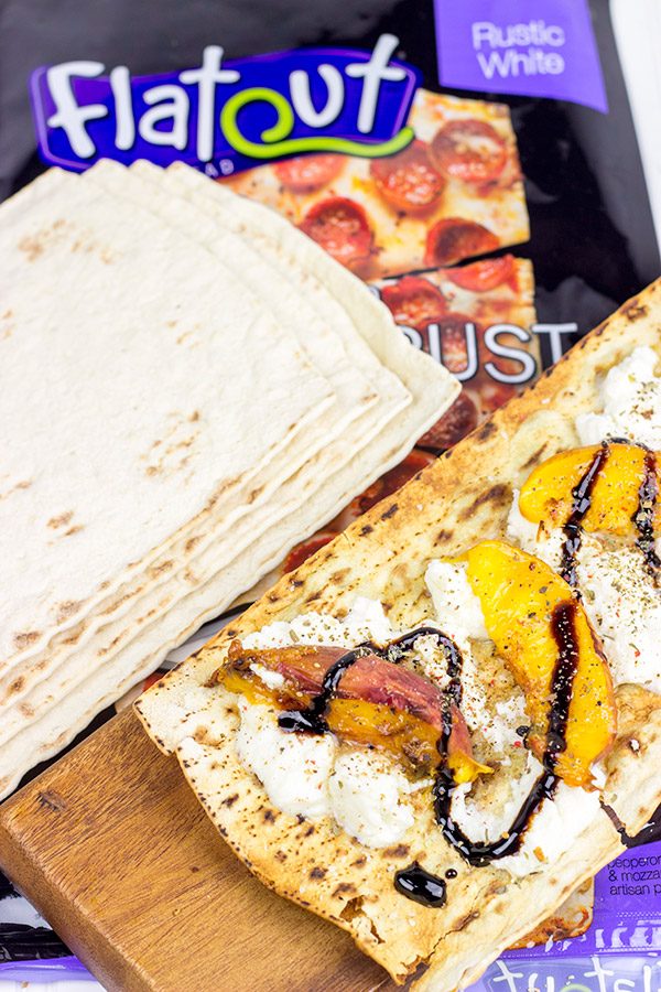 Grab some fresh peaches and toss 'em on the grill! This Grilled Peach and Ricotta Flatbread makes for one awesome summer meal!