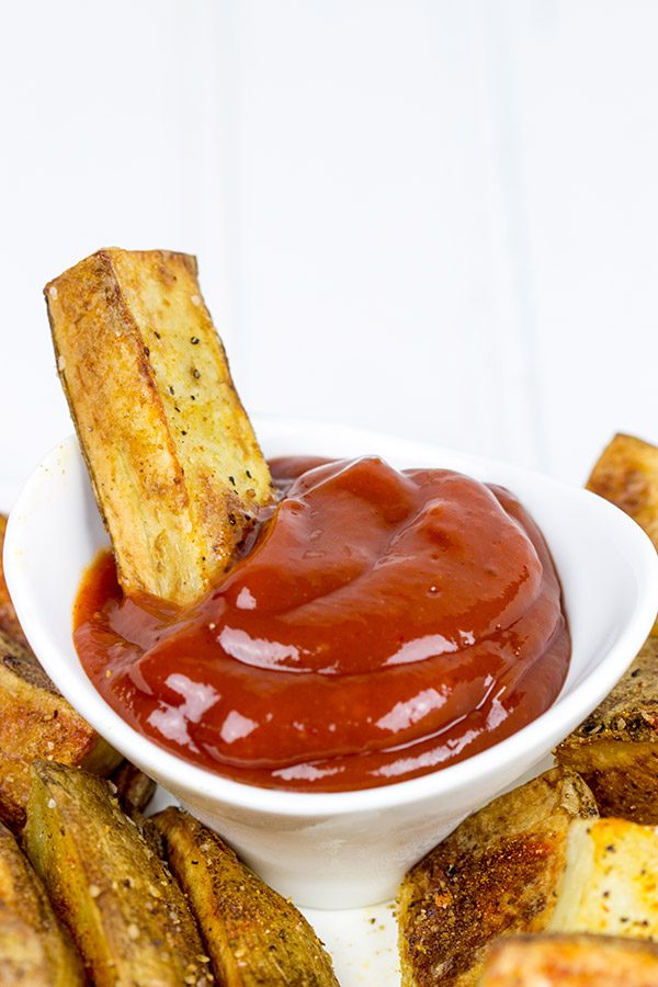 Serve these delicious Oven Roasted Potato Wedges with a quick and easy Smoky Ketchup. I dare you to just eat one!