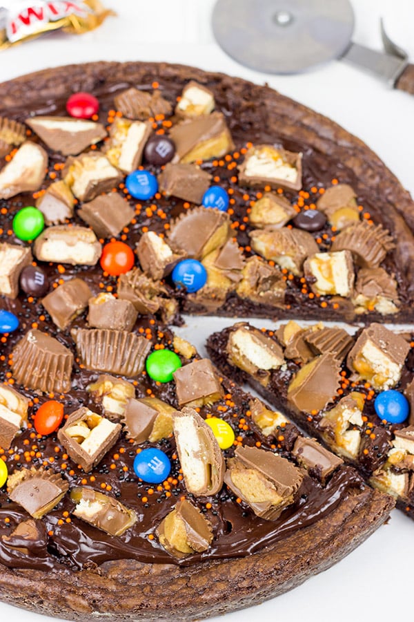 This Brownie Pizza is a fun way to use some of that extra Halloween candy this year!