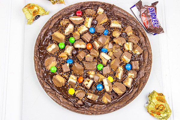 This Brownie Pizza is a fun way to use some of that extra Halloween candy this year!