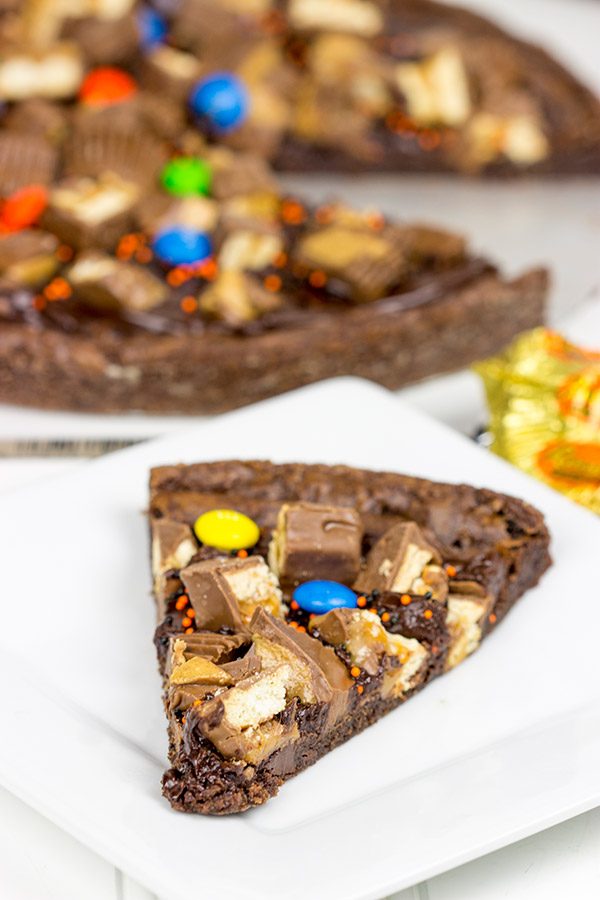 This Brownie Pizza is a fun way to use some of that extra Halloween candy this year!