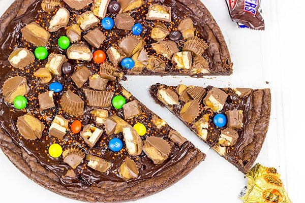 This Brownie Pizza is a fun way to use some of that extra Halloween candy this year!