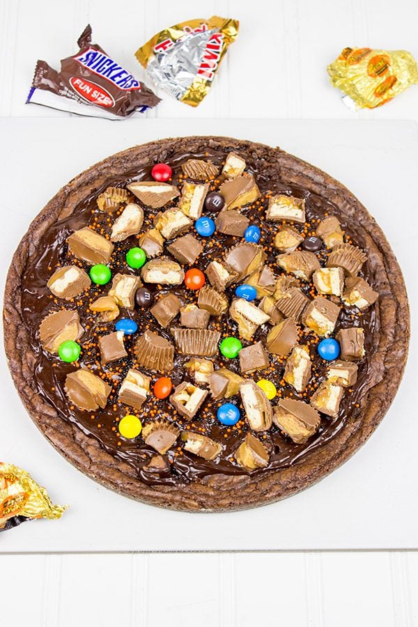 This Brownie Pizza is a fun way to use some of that extra Halloween candy this year!
