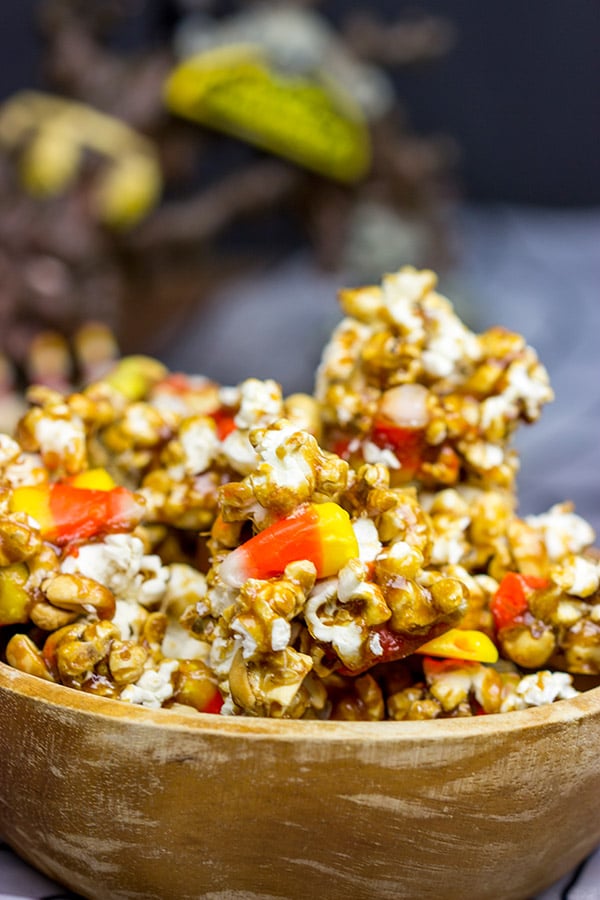 Grab some extra candy corn and whip up a batch of this tasty Halloween Caramel Corn!