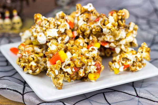 Grab some extra candy corn and whip up a batch of this tasty Halloween Caramel Corn!