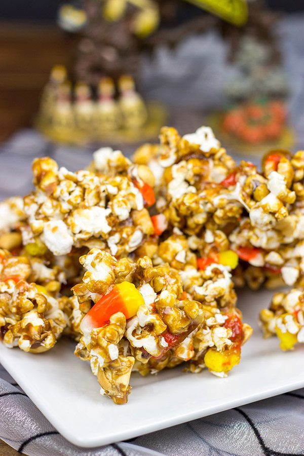 Grab some extra candy corn and whip up a batch of this tasty Halloween Caramel Corn!