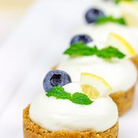 Featuring a blueberry almond crust topped with a light lemon cream, these Lemon Blueberry Almond Bites make for a great summer dessert!