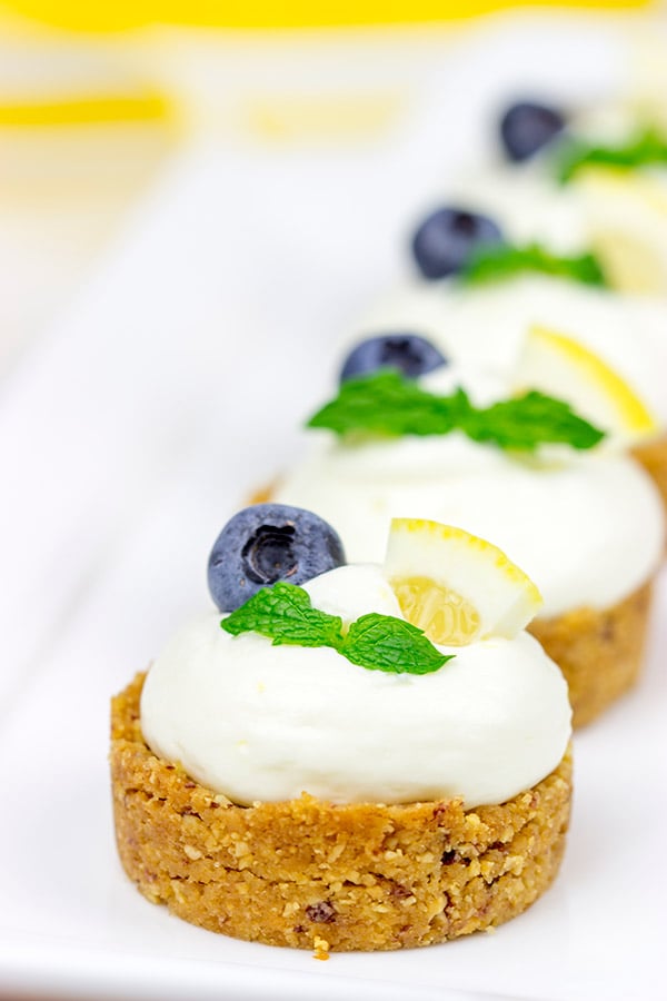 Featuring a blueberry almond crust topped with a light lemon cream, these Lemon Blueberry Almond Bites make for a great summer dessert!