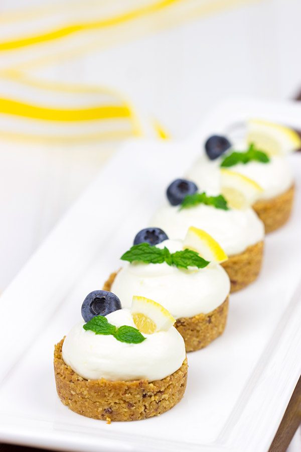 Featuring a blueberry almond crust topped with a light lemon cream, these Lemon Blueberry Almond Bites make for a great summer dessert!