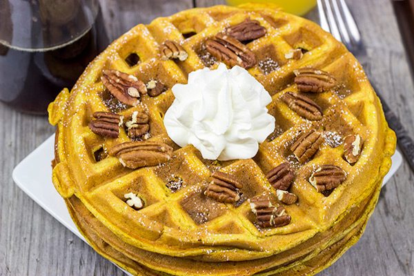 These Pecan Pumpkin Waffles are packed with tasty autumn spices...and they're perfect for Sunday morning breakfast!