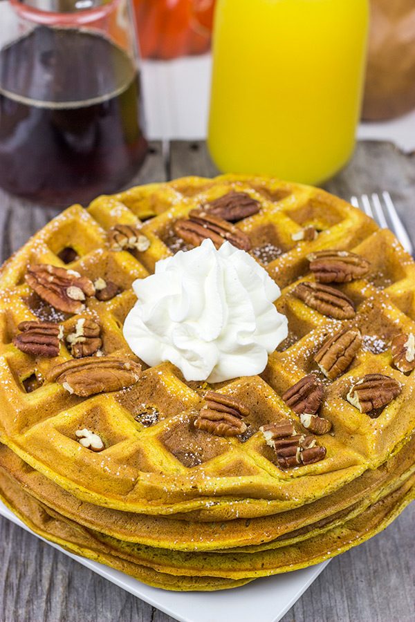 These Pecan Pumpkin Waffles are packed with tasty autumn spices...and they're perfect for Sunday morning breakfast!