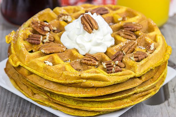 These Pecan Pumpkin Waffles are packed with tasty autumn spices...and they're perfect for Sunday morning breakfast!
