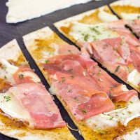 Step up your snack time with these easy Brie and Fig Jam Flatbreads!